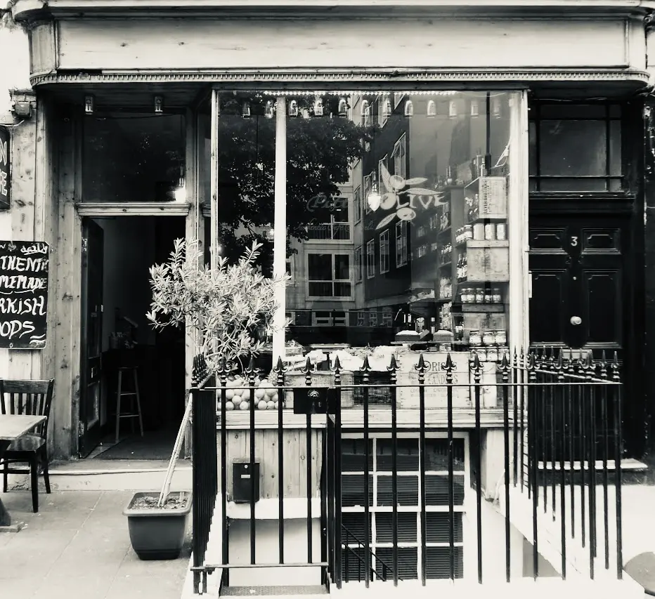The Pitted Olive shopfront on Leigh Street with its olive-branch window sign and handwritten chalkboard